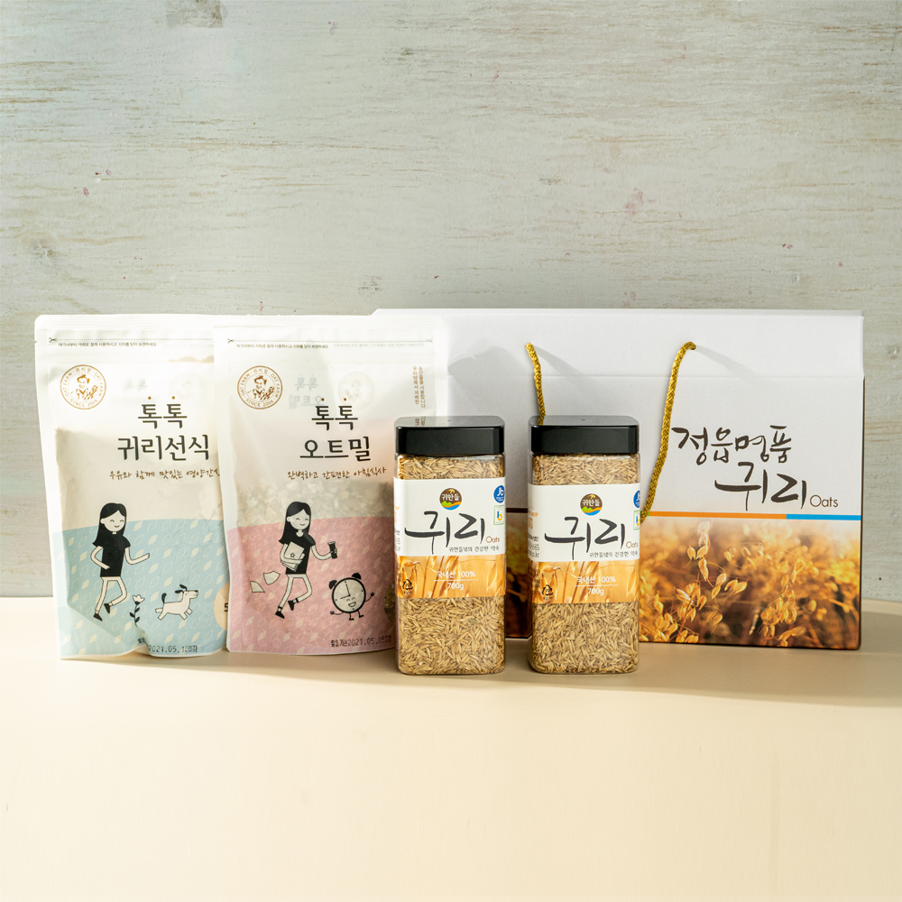 손잡이가 달린 정읍명품귀리 전용 선물박스와 나란히 놓인 귀리 700g 병 2개, 귀리선식·오트밀 파우치
